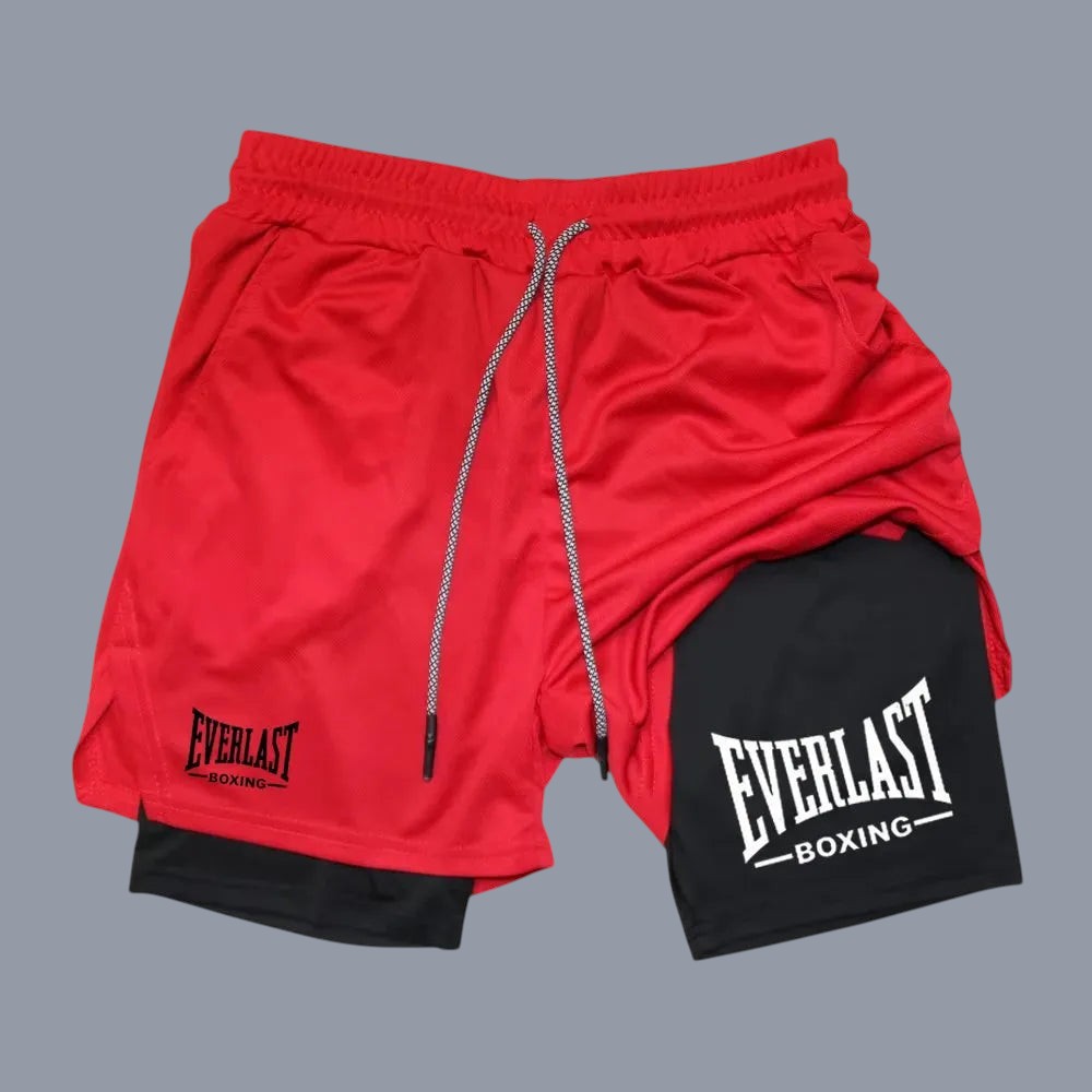 Red and black athletic shorts with Everlast Boxing logo on a white background